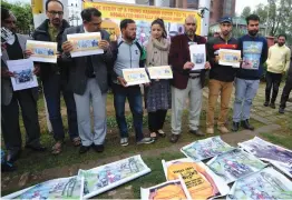  ?? — H. U. NAQASH ?? Human Shield victim Farooq Ahmad Dar ( centre), joined by civil society members, hold a protest in Srinagar on Monday. Dar, last year on the same day, was used by Army as human shield by tying him to army vehicle to terrify the stone pelting youth who...