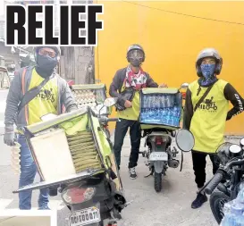  ?? PHOTO BY KHALID GOROSPE ?? Riders of Oridoo Halal Delivery Service prep up to distribute food and water to security personnel in various checkpoint­s in the city.