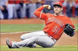  ?? Steve Nesius Associated Press ?? ANGELS third baseman Jefry Marte makes a throw from the turf after knocking down a ground ball hit by Tampa Bay’s Kevin Kiermaier in the first inning.