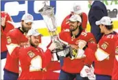  ?? Lynne Sladky Associated Press ?? CENTER Aleksander Barkov skates with the Prince of Wales Trophy after Florida completed the sweep.