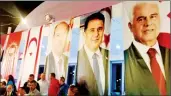  ?? ?? Portraits of Ersin Tatar, Ersan Saner and former UBP leader Derviş Eroğlu at a reception held on Monday to mark the party’s 46th anniversar­y