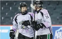  ?? BRITTON LEDINGHAM ?? Rocky Mountain Raiders’ Meg Dyer, left, and Kara Kondrat celebrate a goal against the Prince Albert Northern Bears Monday.