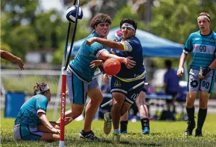  ?? Michael Ciaglo / Houston Chronicle ?? Washington Admirals chaser Raul Natera scores on Detroit Innovators beater Jack Slater during the Major League Quidditch national tournament Saturday in League City. The tournament, which drew 12 teams from across the country, concludes today.