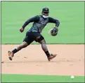  ?? JULIO CORTEZ / AP ?? Orioles infielder Dilson Herrera fields a ground ball Tuesday during training camp in Baltimore.