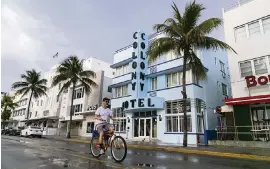  ?? MATIAS J. OCNER mocner@miamiheral­d.com ?? Martin Nesvig, 52, a Miami Beach resident, rides his bike down Ocean Drive near the Colony Hotel in Miami Beach on Wednesday.