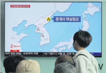  ??  ?? THE BIG CLEAN-UP: People watch a TV screen reporting that North Korea will dismantle nuke test site during a news show at the Seoul Railway Station in Seoul, South Korea.