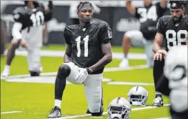  ?? John Locher The Associated Press ?? Their teammates speak glowingly about Raiders rookies Henry Ruggs, above, and Bryan Edwards, who give the receiving corps much-needed speed and size.