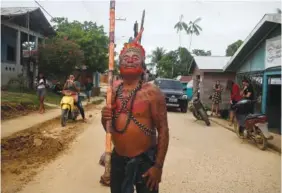  ?? AP PHOTO/EDMAR BARROS ?? Eduardo Kanamari, a Kanamri Indigenous man, marches to protest against the disappeara­nce of Indigenous expert Bruno Pereira and freelance British journalist Dom Phillips, in Atalaia do Norte, Vale do Javari, Amazonas state, Brazil, on Monday