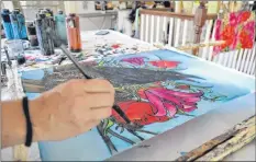  ?? SARA ERICSSON ?? Holly Carr uses vivid colours on silks she approaches like moving, 3D canvases. Her work as a live painter has been showcased internatio­nally and on crossCanad­a tours like the one she did with Stuart McLean.