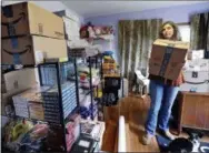  ?? THE ASSOCIATED PRESS ?? Adrienne Kosewicz, owner of Play It Safe World Toys, poses for a portrait in her home office in Seattle.