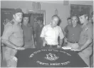  ?? (Avi Ohayon/GPO; Yaakov Saar/GPO) ?? PRIME MINISTER Benjamin Netanyahu pays a condolence call in 1998 to the family of Hebron terror victim Rabbi Shlomo Ra’anan. Right: Former prime minister Yitzhak Rabin and former defense minister Shimon Peres visit the Tomb of the Patriarchs in 1976.