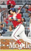  ?? AP PHOTO/JOHN BAZEMORE ?? The Atlanta Braves’ Austin Riley drives in a run with a double in the fourth inning Friday against the Washington Nationals in Atlanta.