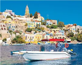  ??  ?? Greece is still proving a popular destinatio­n, with tourists flocking to islands such as Symi, in the Aegean Sea