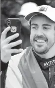  ?? AP ?? Fernando Alonso, of Spain, takes a selfie after winning last month’s IMSA 24-hour race at Florida’s Daytona Internatio­nal Speedway.