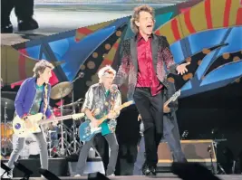  ?? AL DIAZ adiaz@miamiheral­d.com ?? The Rolling Stones’ Ron Wood, left, Keith Richards, center, and Mick Jagger, right, perform at the Ciudad Deportiva de la Habana in Cuba on March 25, 2016. The late Charlie Watts on drums, behind Wood, is not pictured.