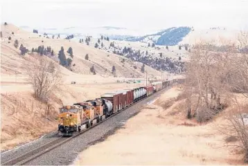  ?? TAILYR IRVINE/THE NEW YORK TIMES ?? Amtrak’s North Coast Hiawatha hasn’t run through Montana in more than 40 years. Some cities in the state hope President Biden will help fund new rail service. Above, a train travels through Montana.