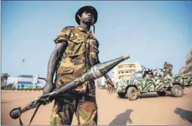  ??  ?? Tension: Soldiers patrolled Bangui at the start of the current conflict, which involves at least 14 warring factions. Photo: Sia Kambou/afp