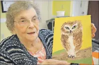  ?? SHARON MONTGOMERY-DUPE/CAPE BRETON POST ?? Viola Morrison, 81, a resident of Seaview Manor, shows a painting of an owl that will be on display at the manor’s art show.