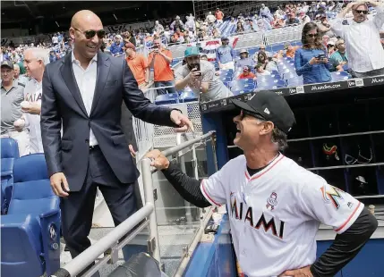  ?? PEDRO PORTAL pportal@miamiheral­d.com ?? CEO Derek Jeter and manager Don Mattingly were hopeful but had a lot of work ahead as they talked before the 2018 home opener against the Chicago Cubs in the first season of new Marlins ownership. Now in Year 3, they will face the Cubs in the playoffs beginning Wednesday.