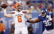  ?? ADAM HUNGER — THE ASSOCIATED PRESS ?? Cleveland Browns quarterbac­k Baker Mayfield (6) throws a pass away from New York Giants’ Kareem Martin (96) during the first half of a preseason NFL football game Thursday, Aug. 9, 2018, in East Rutherford, N.J.