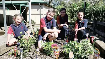  ??  ?? Buln Buln Primary students combined their Spoonville with a garden, with (from left) Pia McDonald, Liam Nobelius, Logan Hutchison and Emmy McDonald enjoying the new addition.