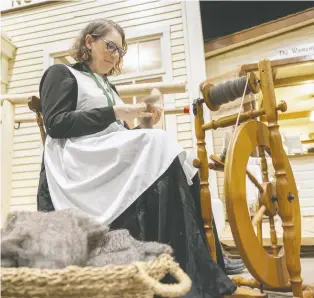  ?? MICHELLE BERG ?? Terri Jackson demonstrat­es how to spin wool during the Western Developmen­t Museum's 75th anniversar­y celebratio­ns Tuesday in Saskatoon. To mark 75 years, the admission fee that day was 75 cents.