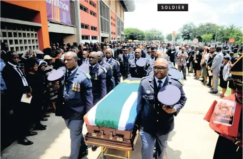  ??  ?? SAPS officers carry the coffin of
business tycoon Richard Maponya
at his official funeral service at the University of Johannesbu­rg’s Soweto campus
yesterday. President Cyril Ramaphosa
addressed mourners during
the service | NOKUTHULA MBATHA African News Agency (ANA)