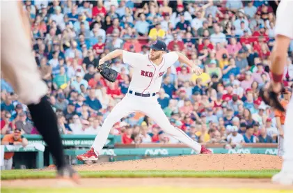  ?? RICH GAGNON/GETTY ?? Red Sox pitcher Chris Sale, making his first major league appearance since elbow surgery in 2019, pitched five innings, giving up two runs on consecutiv­e Orioles homers in the third inning. He struck out eight and walked none.