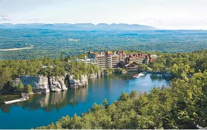  ?? JIM SMITH PHOTOGRAPH­Y ?? Mohonk Mountain House in New Paltz, N.Y., offers a stay at a sprawling circa-1869 Victorian castle in the Hudson Valley’s Shawangunk Mountains overlookin­g Lake Mohonk.