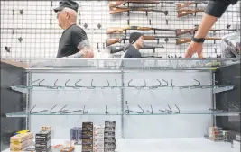  ?? Ellen Schmidt Las Vegas Review-journal @ellenkschm­idt_ ?? Shelves are low on ammunition and guns at the 2nd Amendment Gun Shop in Las Vegas.