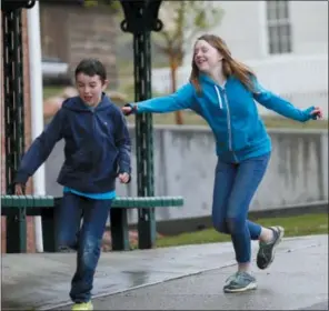  ?? RICK BOWMER — THE ASSOCIATED PRESS ?? Caleb Coulter, 10, left, and his sister Kendra, 12, play tag during a visit to the Place Heritage Park in Salt Lake City. Critics say letting children strike out on their own can expose them to serious dangers. But lawmakers and advocates in several...