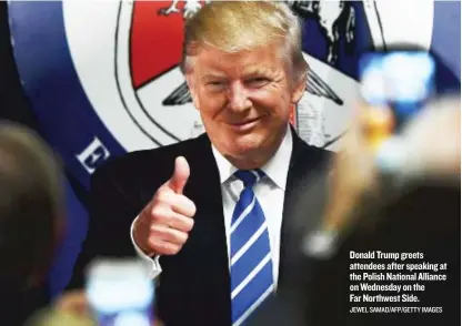  ?? JEWEL SAMAD/ AFP/ GETTY IMAGES ?? Donald Trump greets attendees after speaking at the Polish National Alliance on Wednesday on the Far Northwest Side.