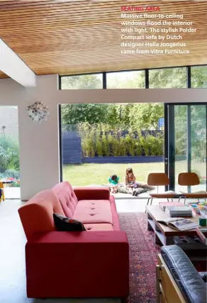  ??  ?? SEATING AREA
Massive floor-to-ceiling windows flood the interior with light. The stylish Polder Compact sofa by Dutch designer Hella Jongerius came from Vitra Furniture