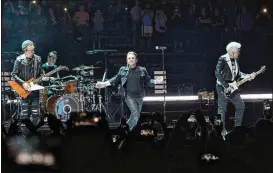  ?? AP PHOTOS ?? U2 just unlocked a quartet of concerts broadcast for the first time on the band’s Youtube channel, dubbed “U2: The Virtual Road.” Each show will be available for only 48 hours, starting with their 2001 “Live from Slane Castle” concert.