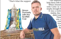  ??  ?? Simon Donnelly with the Scottish Cup