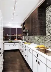  ??  ?? A galley kitchen is a more compact space laid out in a straight line that keeps the work area smaller and allows cooks to work without the obstructio­n of an island.