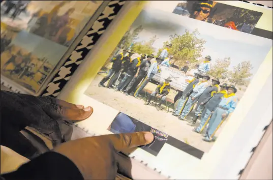  ?? Las Vegas Review-Journal @ellenschmi­dttt ?? Ellen Schmidt
Mitchell Sayles pages through a scrapbook during an event Saturday for Buffalo Soldiers Day at the Culinary Academy of Las Vegas event center in North Las Vegas. The Buffalo Soldiers were the Army’s all-Black units.