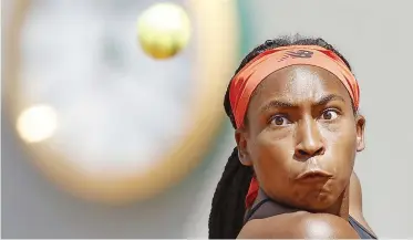  ??  ?? COCO Gauff eyes the ball during her win against Ons Jabeur in Paris yesterday.
| EPA