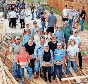  ?? [PHOTOS PROVIDED] ?? Central Oklahoma Habitat for Humanity volunteers on framing day for a home on SW 148.