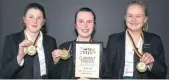  ??  ?? Quiz winners . . . Otago Girls’ High School pupils (from left) Chloe Alexander (14), Emily Gray (14) and Bella Bates (15) display their Otago Daily Times Extra! current events quiz medals.