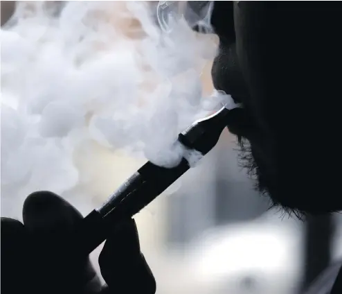  ?? NAM Y. HUH / ASSOCIATED PRESS / CANADIAN PRESS FILES ?? Vaping — with its fruity flavour options — has caught on among this country’s high-schoolers, something Canadian authoritie­s are looking to discourage.