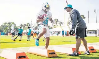  ?? YUTAO CHEN/STAFF PHOTOGRAPH­ER ?? Albert Wilson made at least three catches that would have produced major gains during Friday’s practice. The Dolphins signed the wide receiver to a three-year $24 million deal during the offseason.