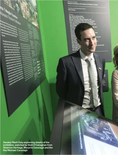  ??  ?? Senator Mark Daly explaining details of the exhibition, watched by Niall O’Callaghan from Shannon Heritage, Marjorie Cavanagh and the Rev Michael Cavanagh