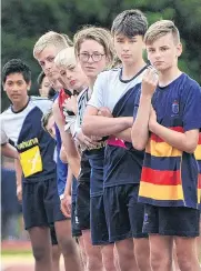  ??  ?? Boys in the 13+ long jump await their turn.