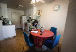  ?? ETHAN SWOPE — SPECIAL TO THE MARIN INDEPENDEN­T JOURNAL ?? Lana Gasparyan eats breakfast at her apartment in Marin City. Gasparyan, who is unemployed because of the pandemic, has fallen behind on payments and was recently notified her rent is going up 8% effective Jan. 1.