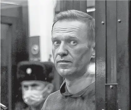  ?? HANDOUT VIA REUTERS ?? A still image taken from video footage shows Russian opposition leader Alexei Navalny inside a defendant dock during the announceme­nt of a court verdict in Moscow on Feb. 2.