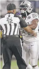  ?? | AP ?? The Raiders’ Marshawn Lynch makes contact with official Greg Steed last week, leading to a one- game suspension.
