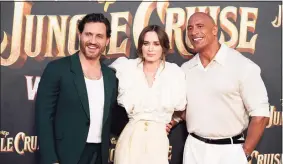  ?? Photos and text from wire services Chris Pizzello / AP ?? From left, Edgar Ramirez, Emily Blunt and Dwayne Johnson, cast members in "Jungle Cruise," pose together at the world premiere of the film.