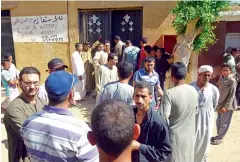  ?? —AFP ?? Egyptians wait outside a hospital to retreive bodies of the victims killed in an attack on Coptic pilgirms on May 26.