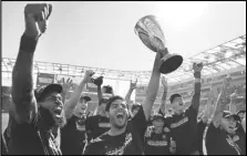  ?? Associated Press ?? Los Angeles FC forward Carlos Vela holds up the cup after defeating Austin FC in the MLS Western Conference Finals on Sunday in Los Angeles. LAFC hosts Philadelph­ia in the Cup Finals today at Banc of California Stadium.